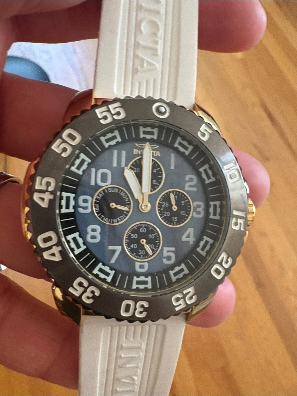 Invicta Gold and Black Chronograph Watch with White Strap
